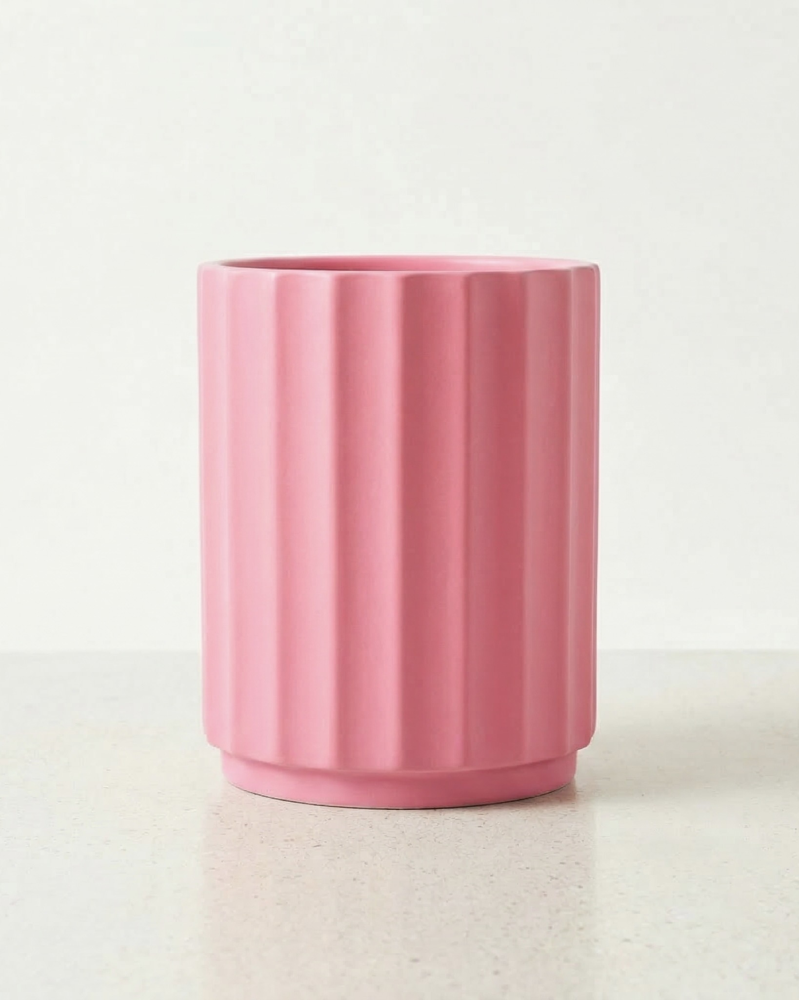 pink fluted cylinder planter in Polystone
