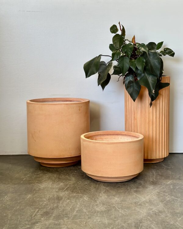Architectural terracotta pots in a 3-piece set. Minimalist designs for versatile indoor and outdoor plant styling